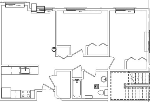 A floor plan of a house with a kitchen, living room, and bathroom.